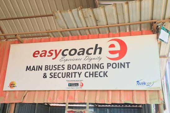 Easy Coach main buses boarding point and security check sign