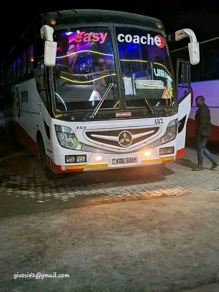 An Easy Coach bus preparing to depart at night