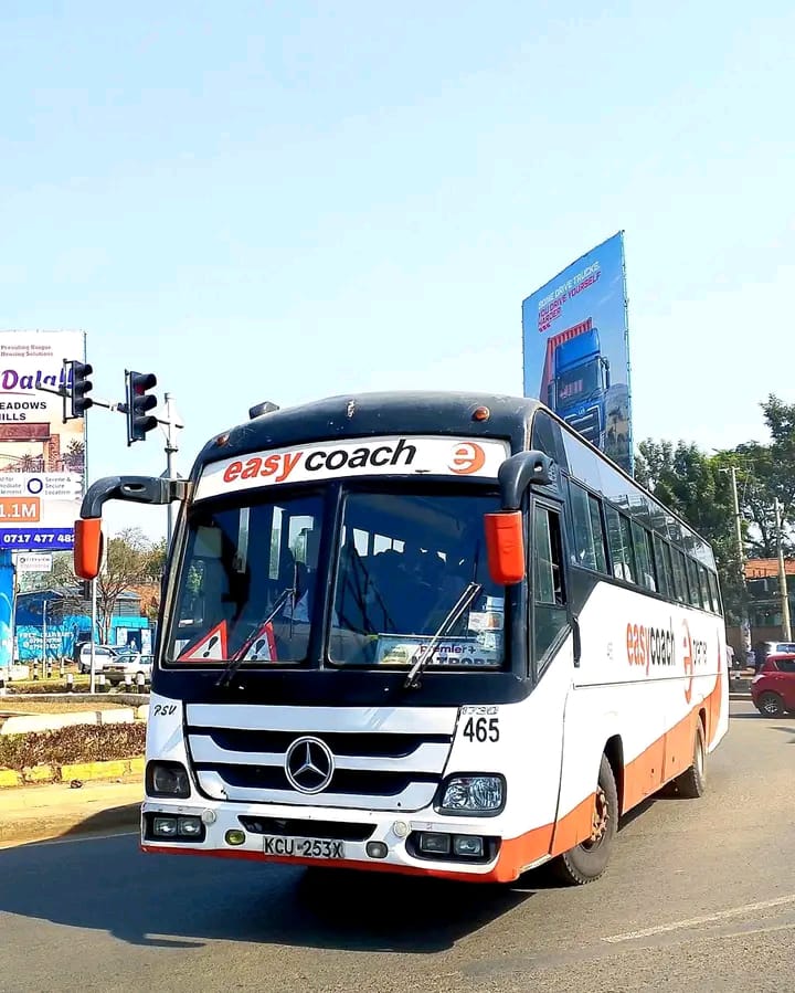 Easy Coach Mercedes coach driving on a city road
